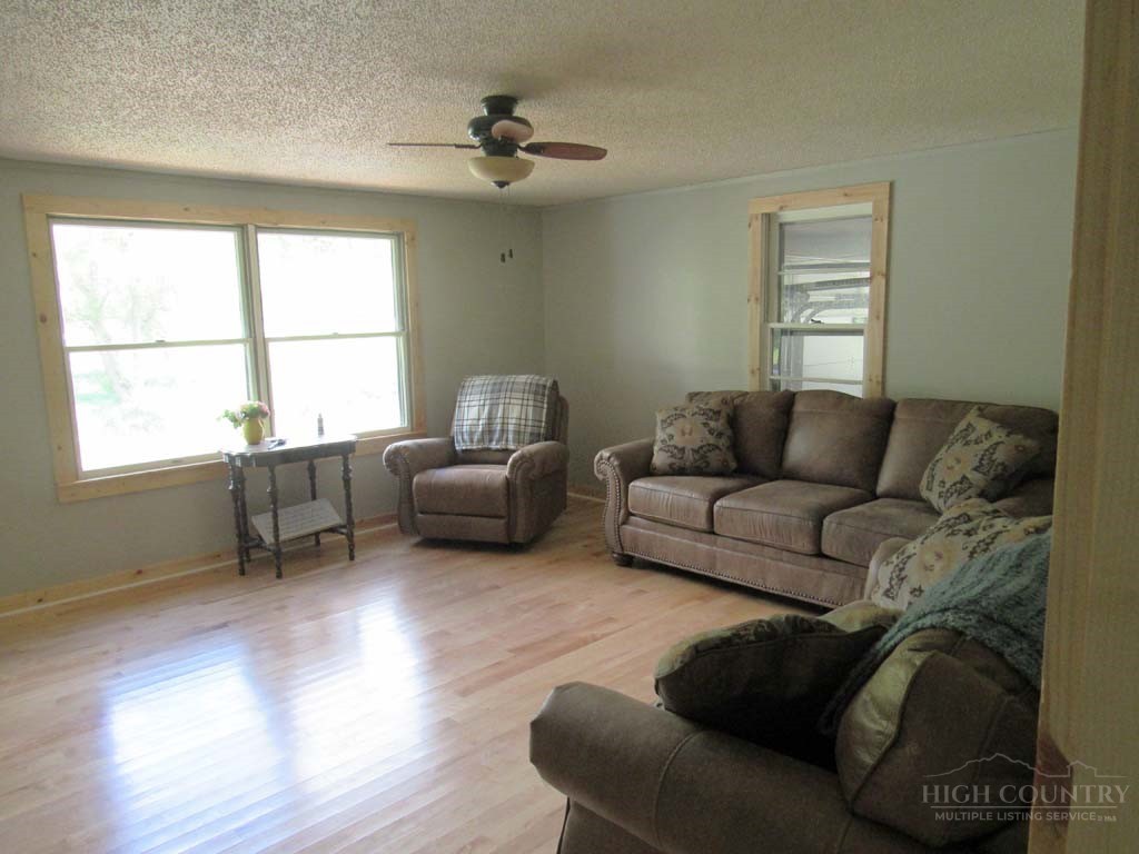 805 Ed Little Road Warrensville, NC 28693 - Photo 31 of 49 a living room with furniture and a window