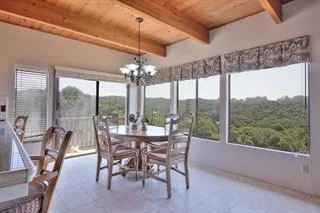 a view of a dining room with furniture wooden floor and chandelier