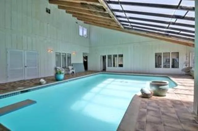 a swimming pool with yard