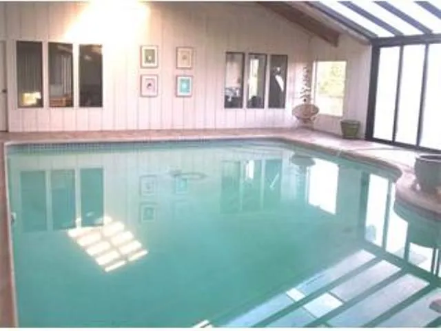 a view of balcony with furniture and wooden floor