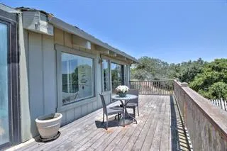 a view of mountain with lake view