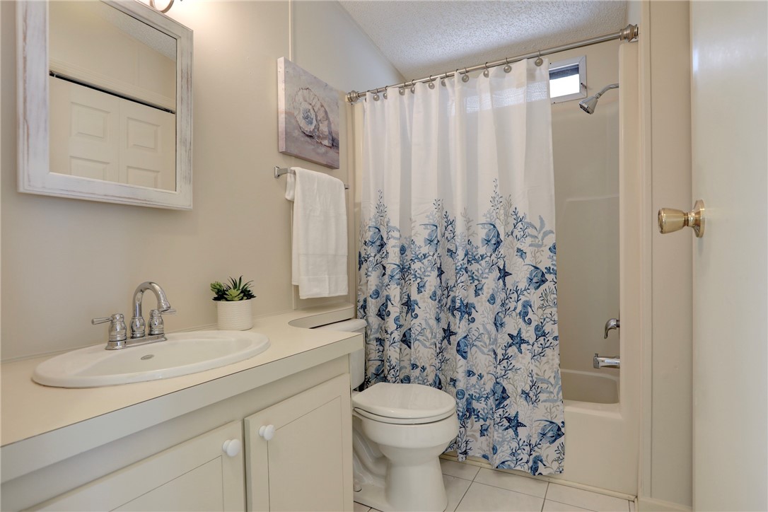 818 Tamarind Circle Sebastian, FL 32976 - Photo 17 of 31 a bathroom with a sink toilet and shower