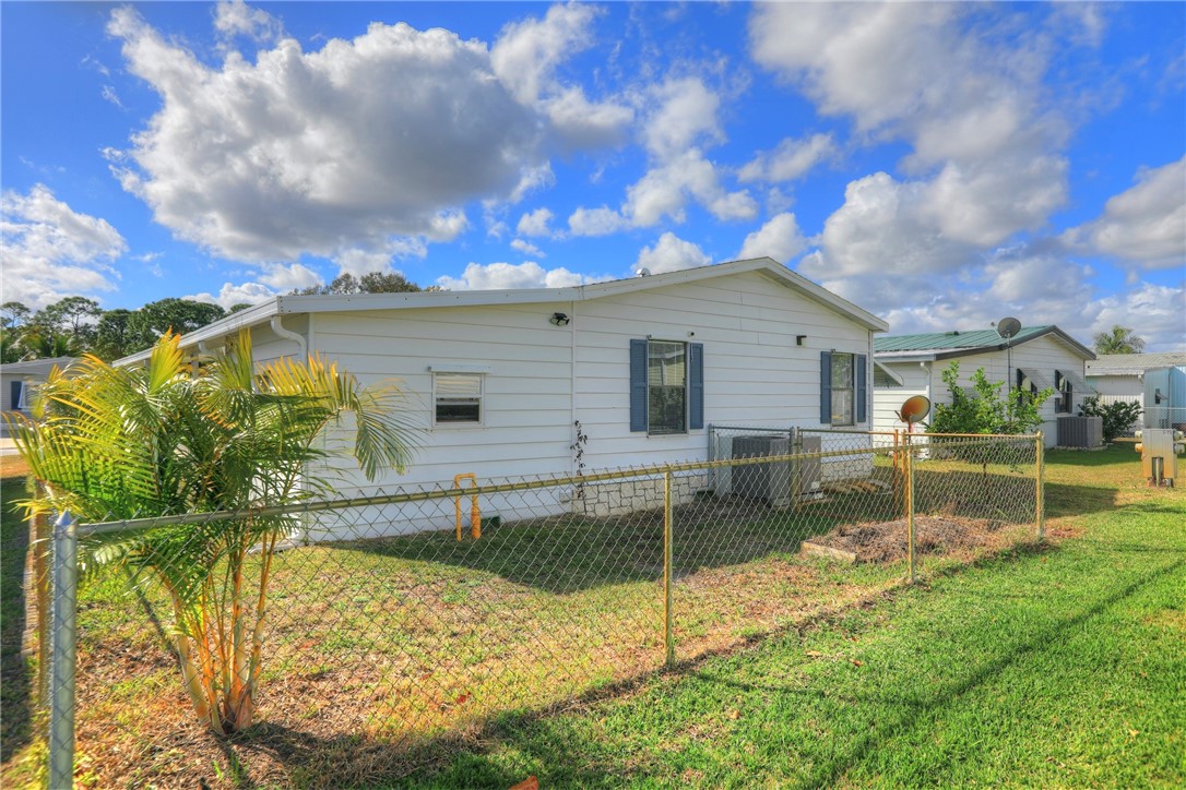 818 Tamarind Circle Sebastian, FL 32976 - Photo 18 of 31 a view of house with backyard