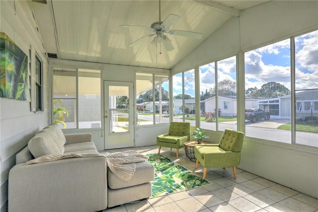 818 Tamarind Circle Sebastian, FL 32976 - Photo 5 of 31 a living room with furniture and a large window