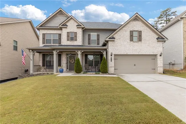 a front view of the house with yard