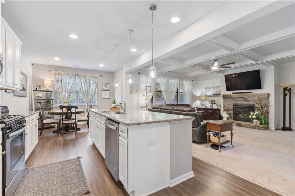 1718 Landon Lane Braselton, GA 30517 - Photo 12 of 52 a kitchen with sink stove and chairs