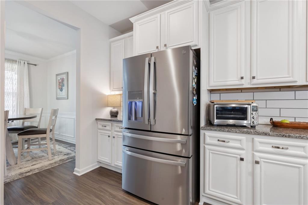 1718 Landon Lane Braselton, GA 30517 - Photo 16 of 52 a kitchen with stainless steel appliances white cabinets and a refrigerator
