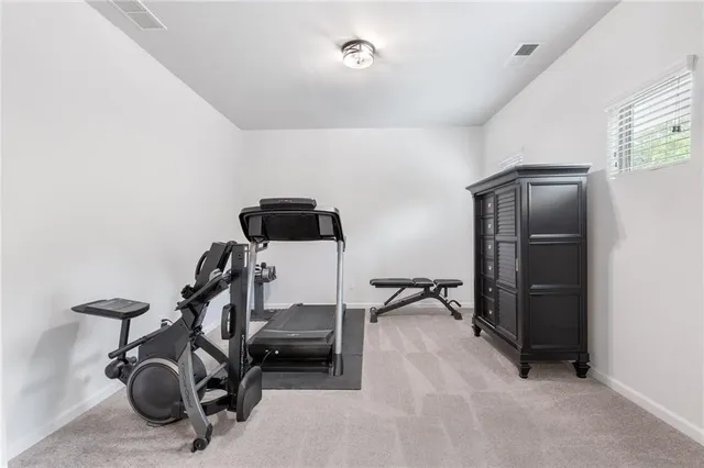 a bathroom with a double vanity sink a mirror and a bathtub