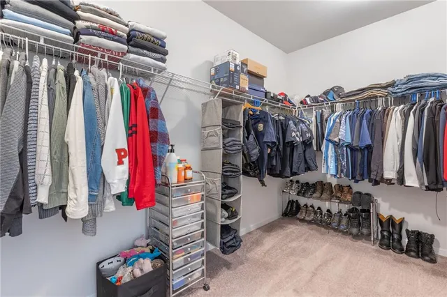 a view of a livingroom and a livingroom with furniture and a couch