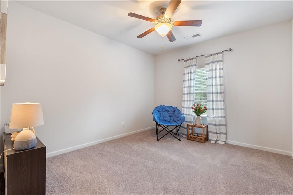 1718 Landon Lane Braselton, GA 30517 - Photo 34 of 52 a view of room with lounge chair and windows