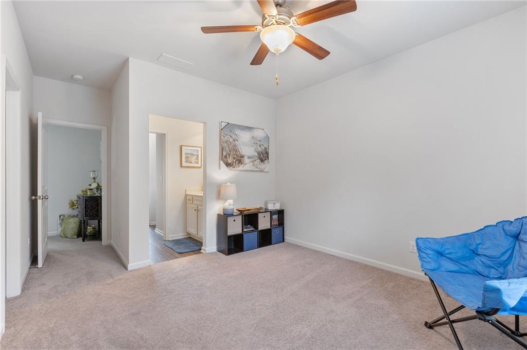 1718 Landon Lane Braselton, GA 30517 - Photo 35 of 52 a view of a livingroom with furniture and a workspace
