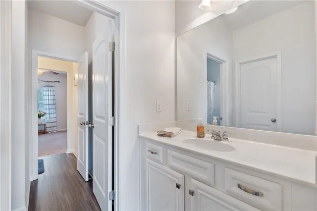 a bathroom with a sink double vanity and a shower