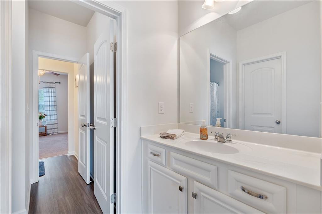 1718 Landon Lane Braselton, GA 30517 - Photo 36 of 52 a bathroom with a sink and a mirror