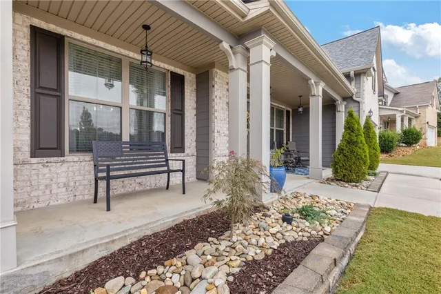 a front view of a house with chairs