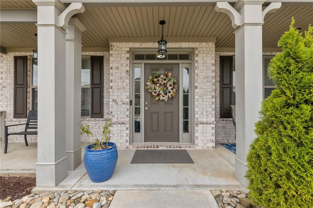 1718 Landon Lane Braselton, GA 30517 - Photo 6 of 52 a front view of a house with chairs