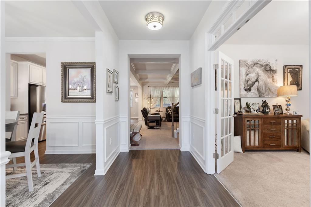 1718 Landon Lane Braselton, GA 30517 - Photo 8 of 52 a view of a livingroom with wooden floor and furniture