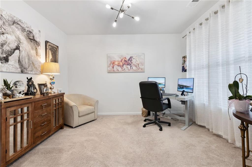 1718 Landon Lane Braselton, GA 30517 - Photo 9 of 52 a view of a workspace with furniture and a window