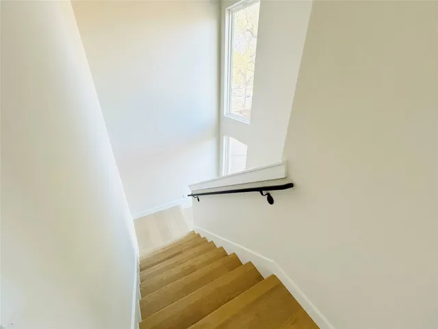 a view of staircase with white walls