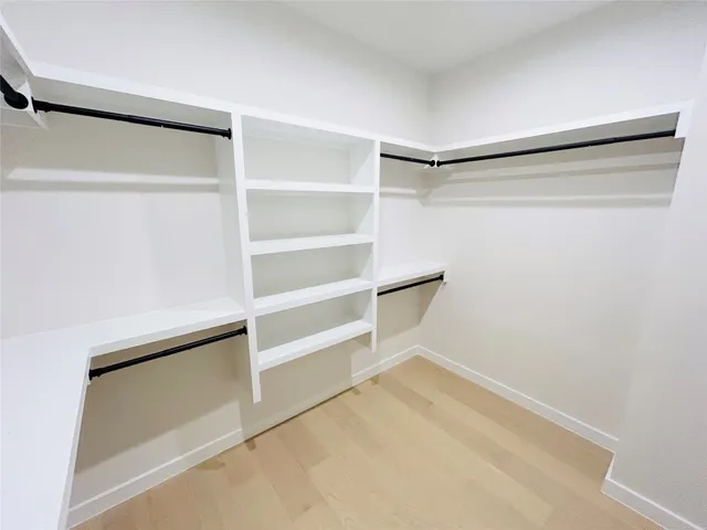 a view of an empty walk in closet