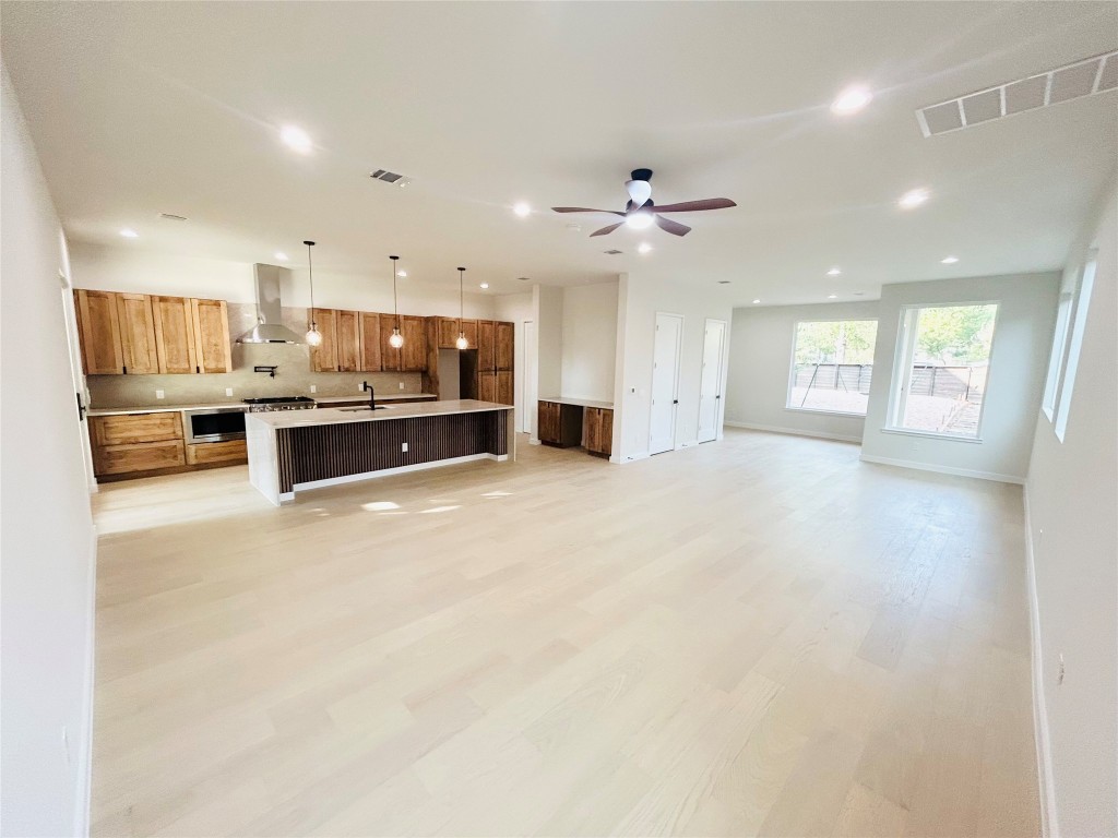 4324 Airport Boulevard, Unit B Austin, TX 78722 - Photo 3 of 22 a large kitchen with a large counter top appliances and cabinets