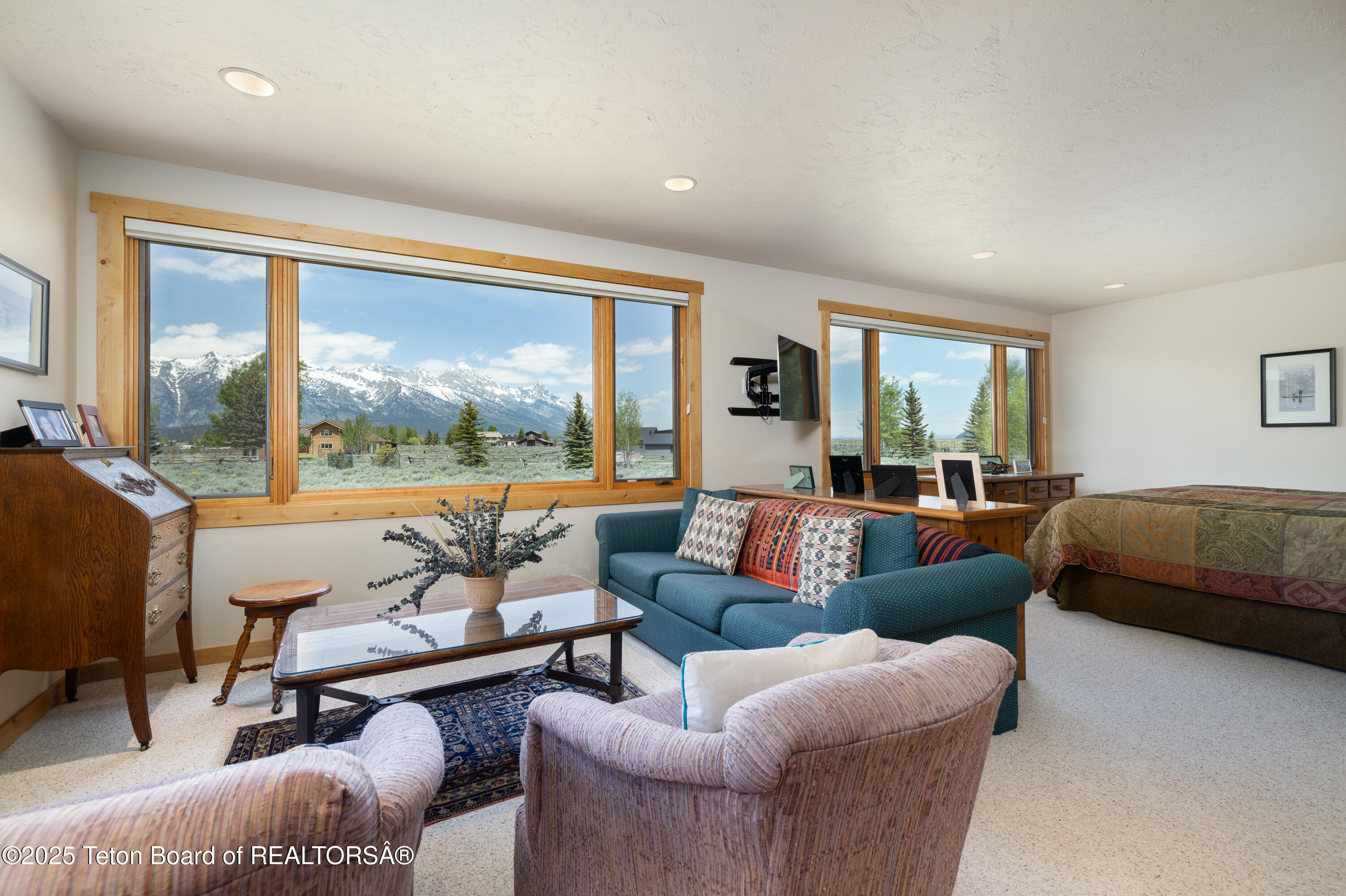 8225 North Spring Gulch Road Jackson, WY 83001 - Photo 15 of 38 Primary Suite Sitting Room w/ View