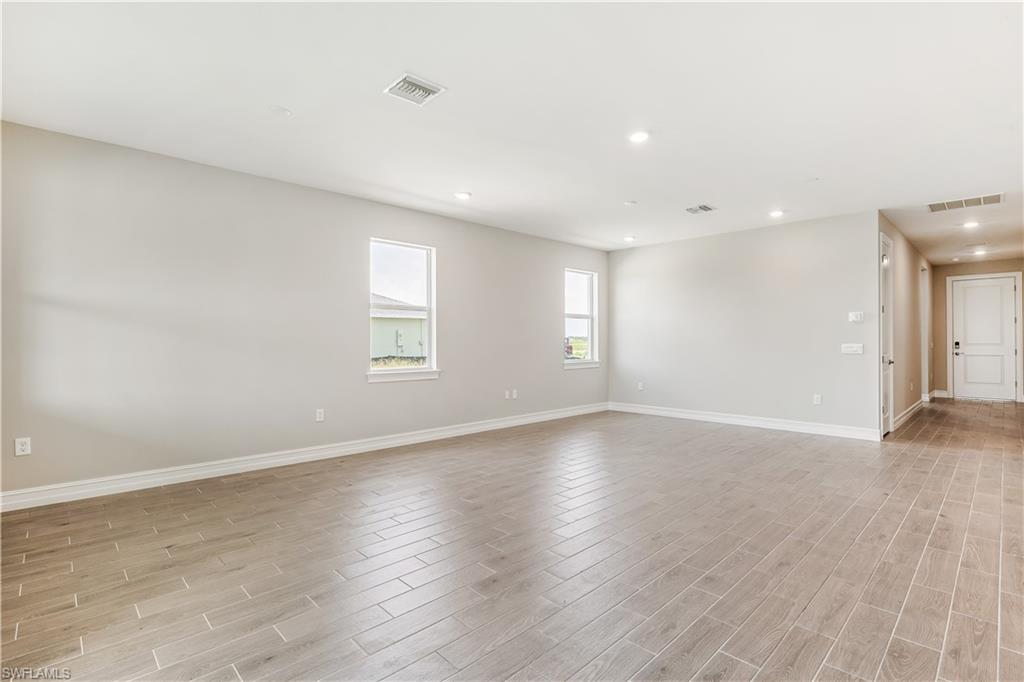 17788 Shade Tree Loop Punta Gorda, FL 33982 - Photo 3 of 44 Spare room with recessed lighting and light wood finished floors