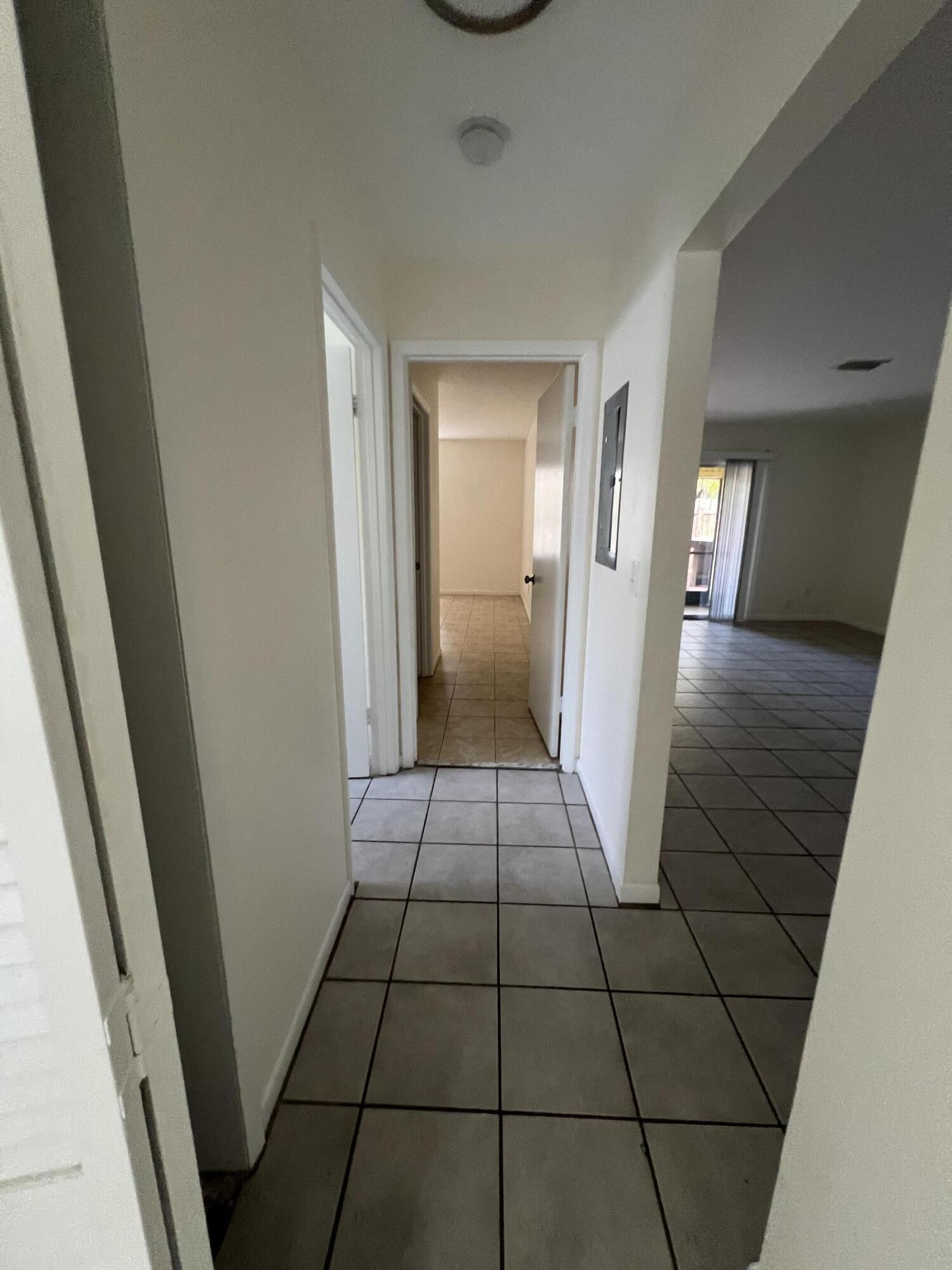 17355 Bush Road, Unit F Jupiter, FL 33458 - Photo 13 of 21 a view of a hallway