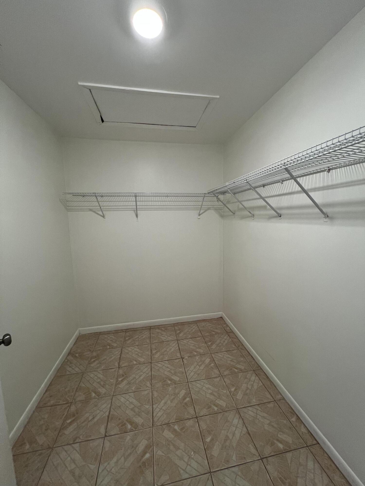 17355 Bush Road, Unit F Jupiter, FL 33458 - Photo 15 of 21 a view of a room with racks on the wall
