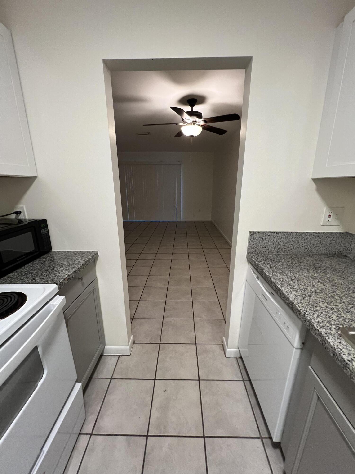 17355 Bush Road, Unit F Jupiter, FL 33458 - Photo 8 of 21 a kitchen with a stove