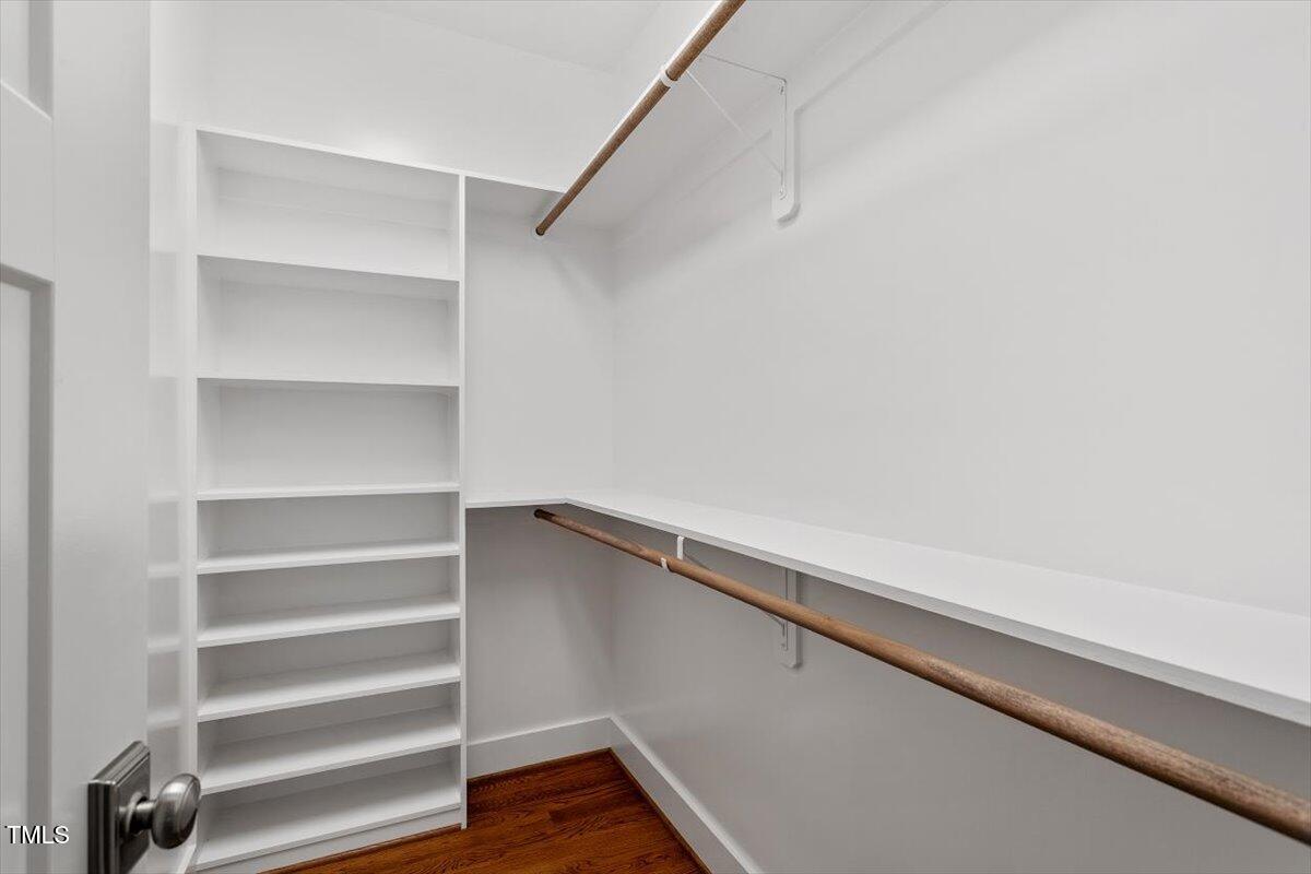 3932 Old Chapel Hill Road Durham, NC 27707 - Photo 28 of 46 a view of walk in closet with empty racks