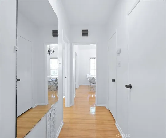 a view of a bedroom from a hallway
