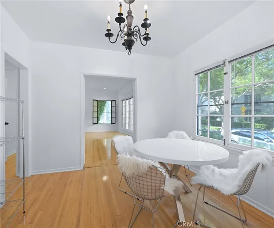a view of a dining room with furniture and window