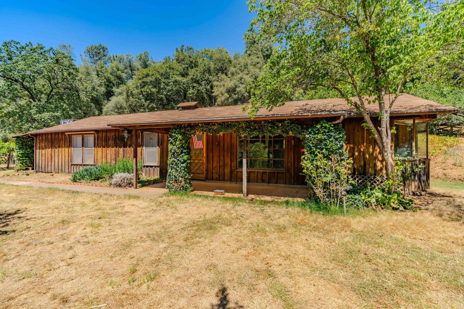 18135 Climax Road Jackson, CA 95642 - Photo 1 of 1 a view of a house with backyard and sitting area