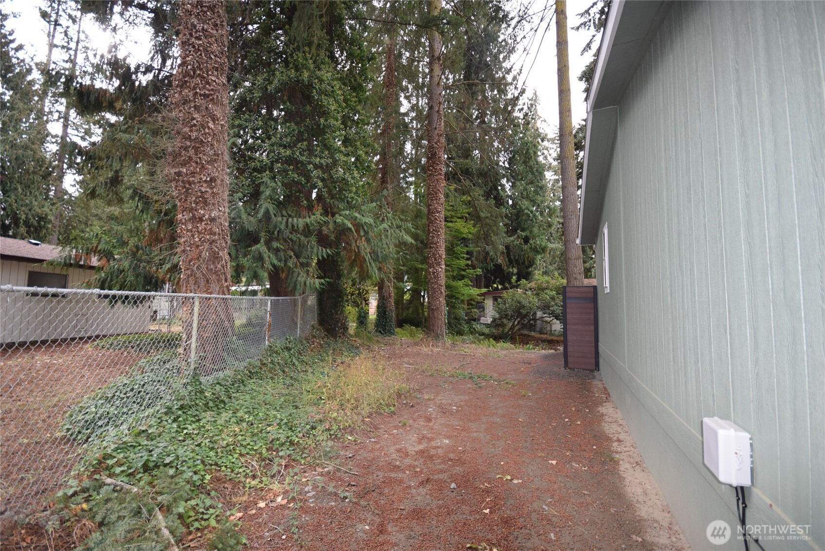 375 Dungeness Meadows Sequim, WA 98382 - Photo 26 of 27 a view of a backyard with trees