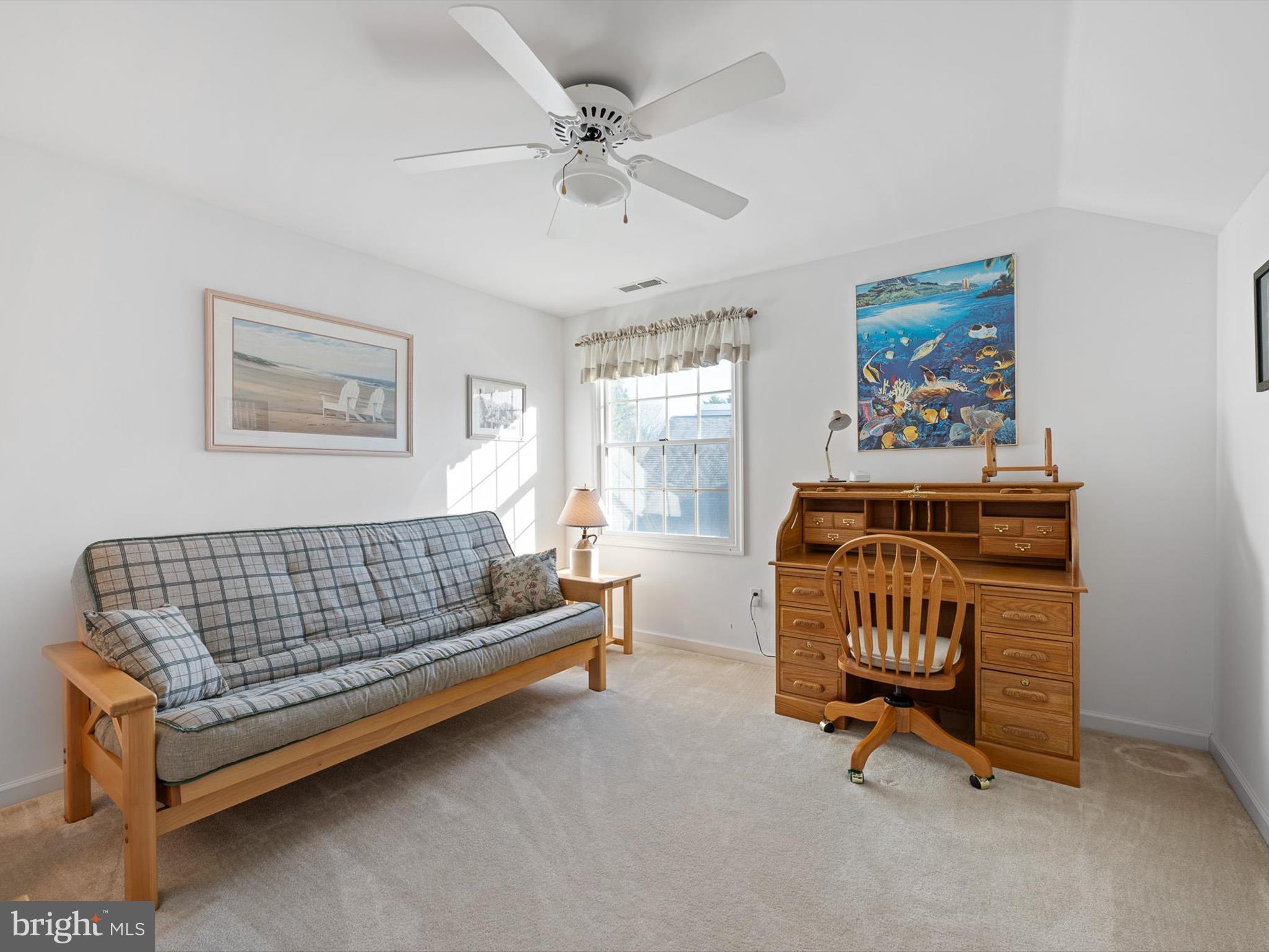 304 Walkabout Road Bethany Beach, DE 19930 - Photo 27 of 62 a bedroom with furniture and a window