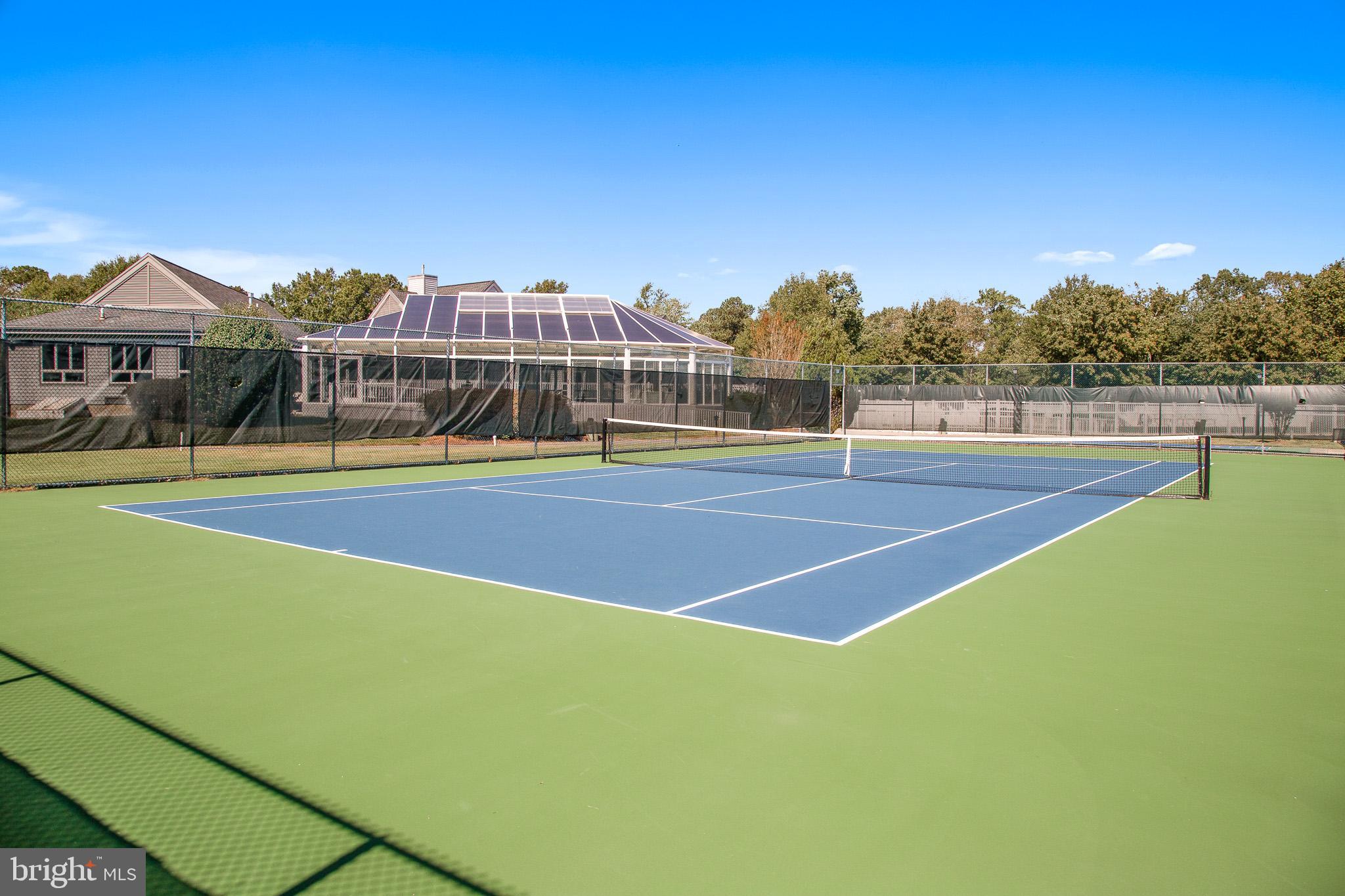 304 Walkabout Road Bethany Beach, DE 19930 - Photo 43 of 62 a view of tennis court with houses