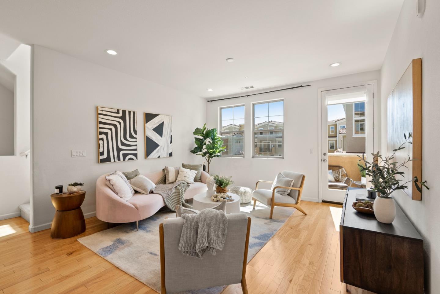 a living room with furniture or couch and a wooden floor