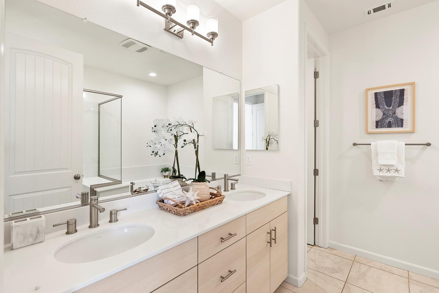 1872 Trento Loop Milpitas, CA 95035 - Photo 15 of 38 a bathroom with a double vanity sink and a mirror
