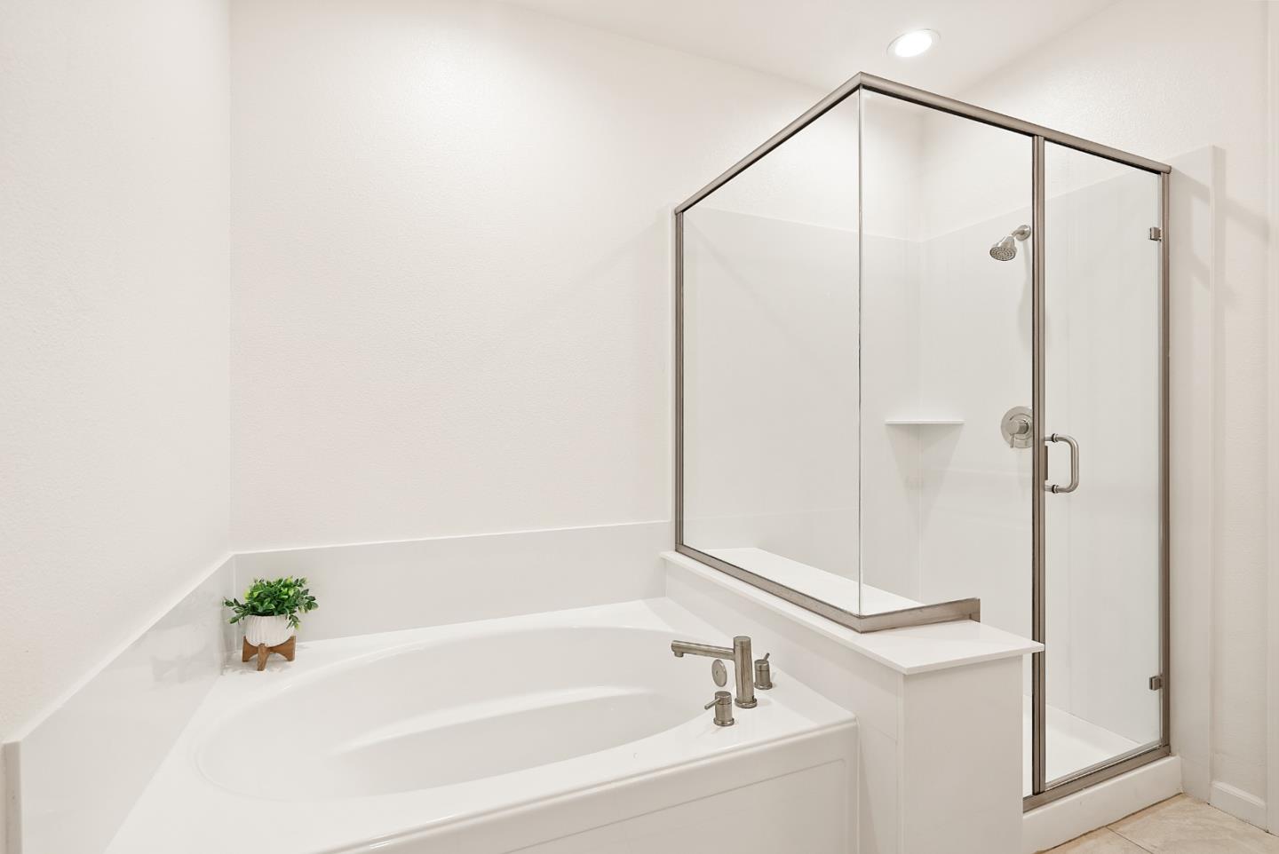 1872 Trento Loop Milpitas, CA 95035 - Photo 16 of 38 a bathroom with a bathtub and a shower