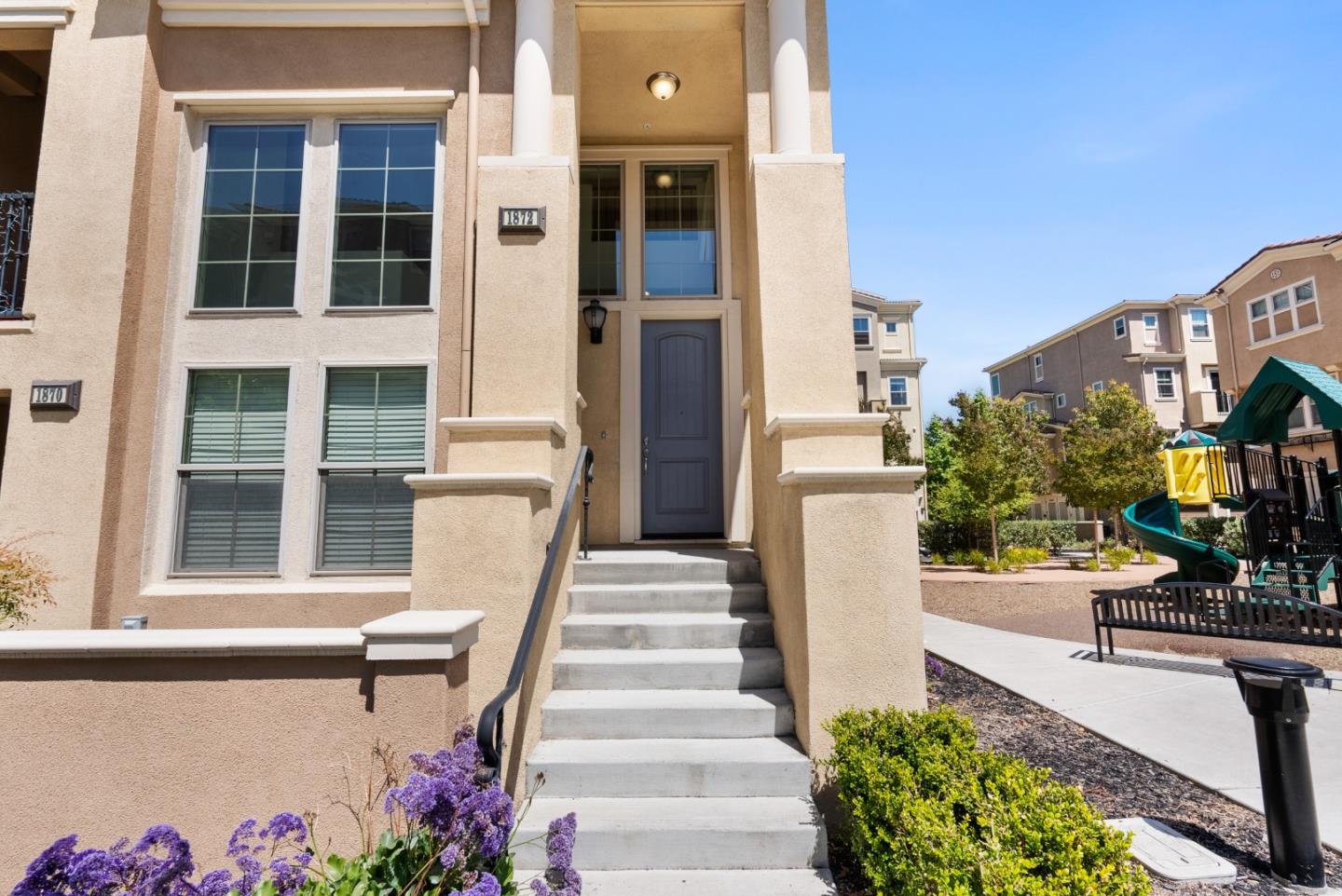 1872 Trento Loop Milpitas, CA 95035 - Photo 2 of 38 a front view of a house with a garden