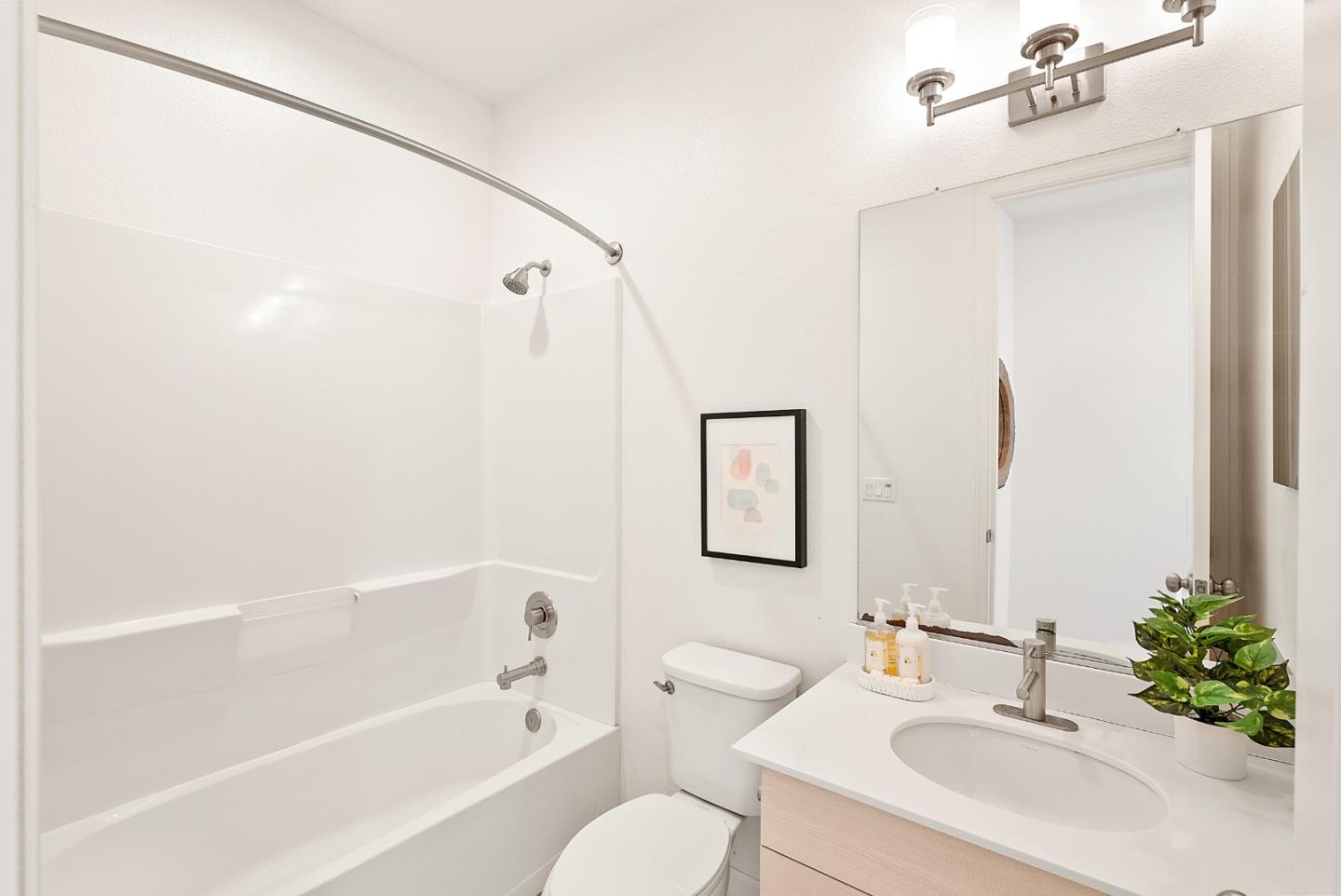 1872 Trento Loop Milpitas, CA 95035 - Photo 23 of 38 a bathroom with a sink vanity mirror and bathtub