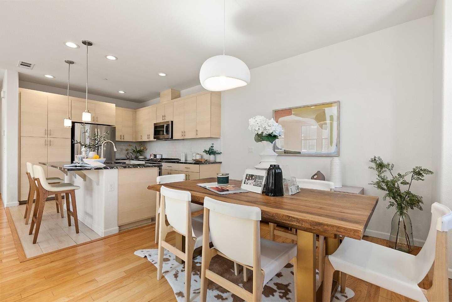 1872 Trento Loop Milpitas, CA 95035 - Photo 8 of 38 a kitchen with kitchen island granite countertop a sink and a refrigerator