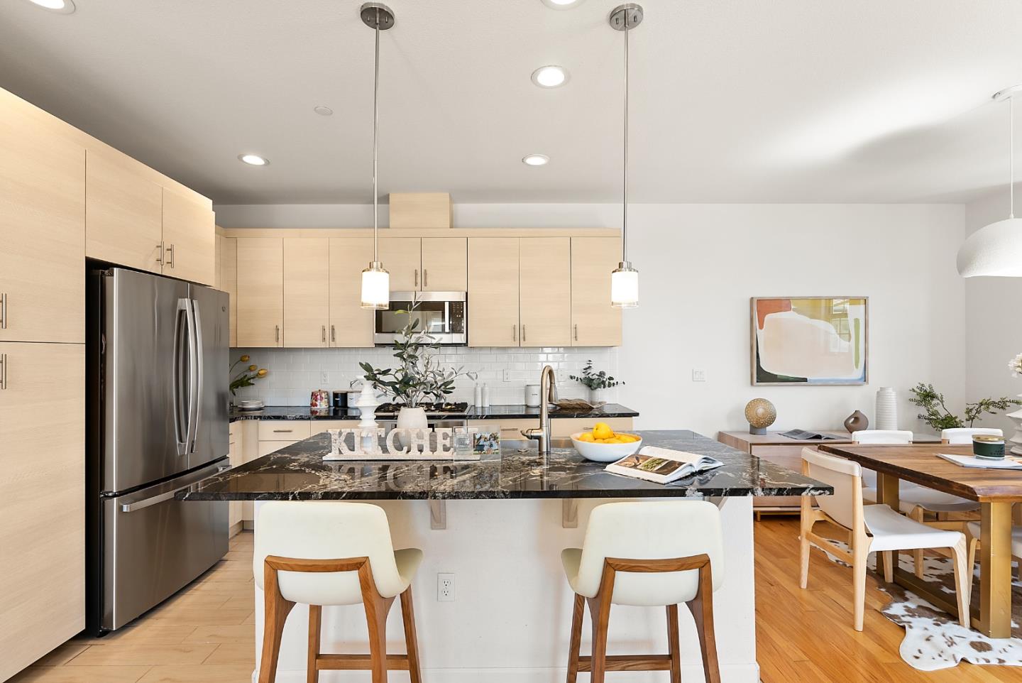 1872 Trento Loop Milpitas, CA 95035 - Photo 9 of 38 a kitchen with stainless steel appliances granite countertop a sink refrigerator and cabinets