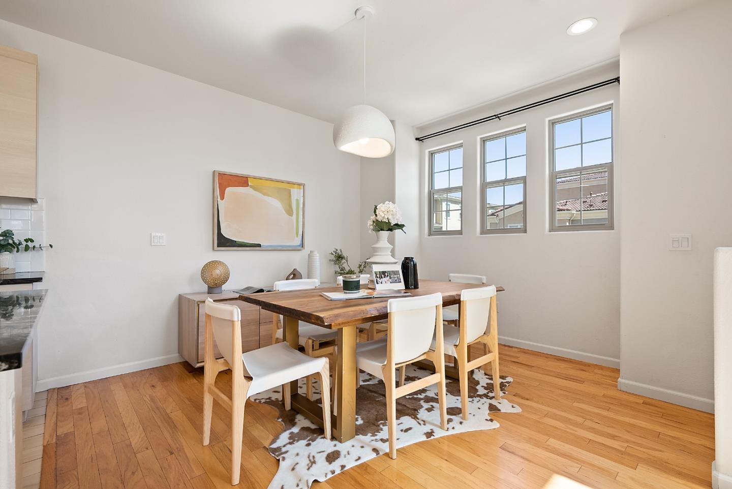 1872 Trento Loop Milpitas, CA 95035 - Photo 10 of 38 a view of a dining room with furniture and wooden floor