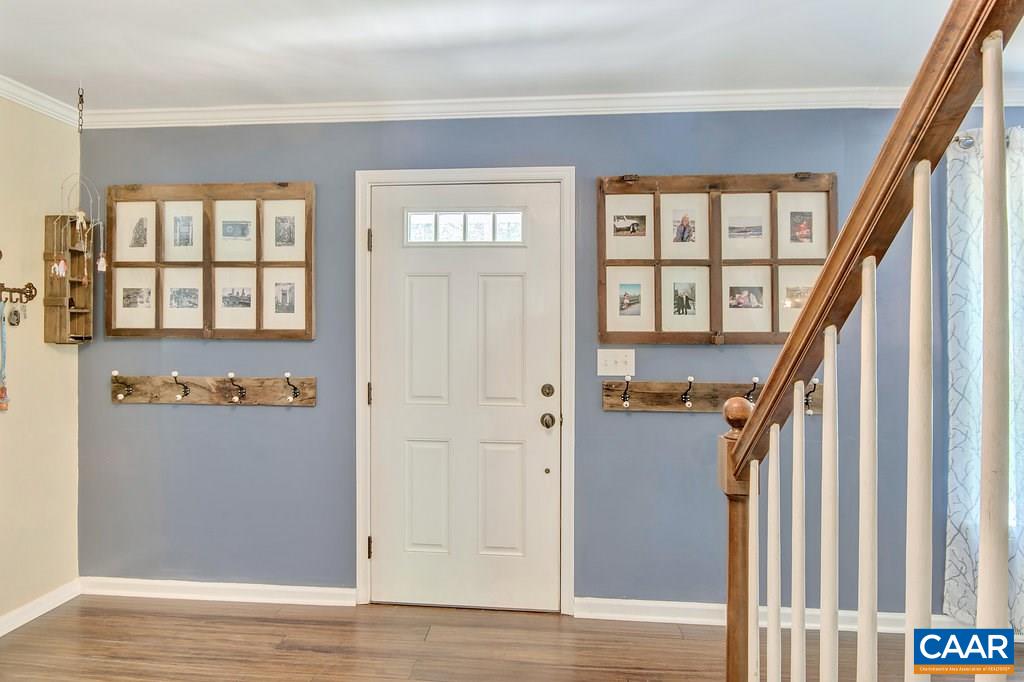 2333 Whippoorwill Road Charlottesville, VA 22901 - Photo 3 of 49 a view of an entryway with wooden floor and stairs