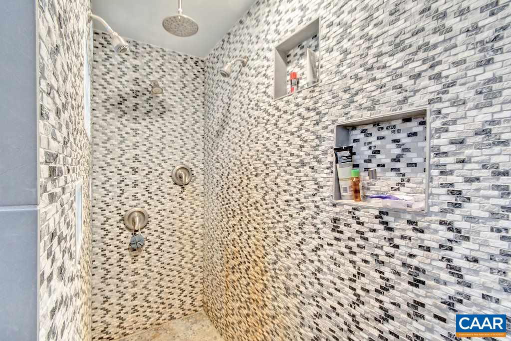 2333 Whippoorwill Road Charlottesville, VA 22901 - Photo 31 of 49 a bathroom with a shower and a shower curtain