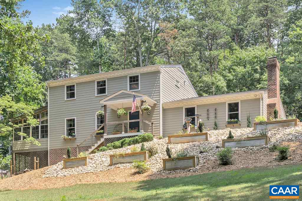 2333 Whippoorwill Road Charlottesville, VA 22901 - Photo 46 of 49 a front view of a house with a yard table and chairs