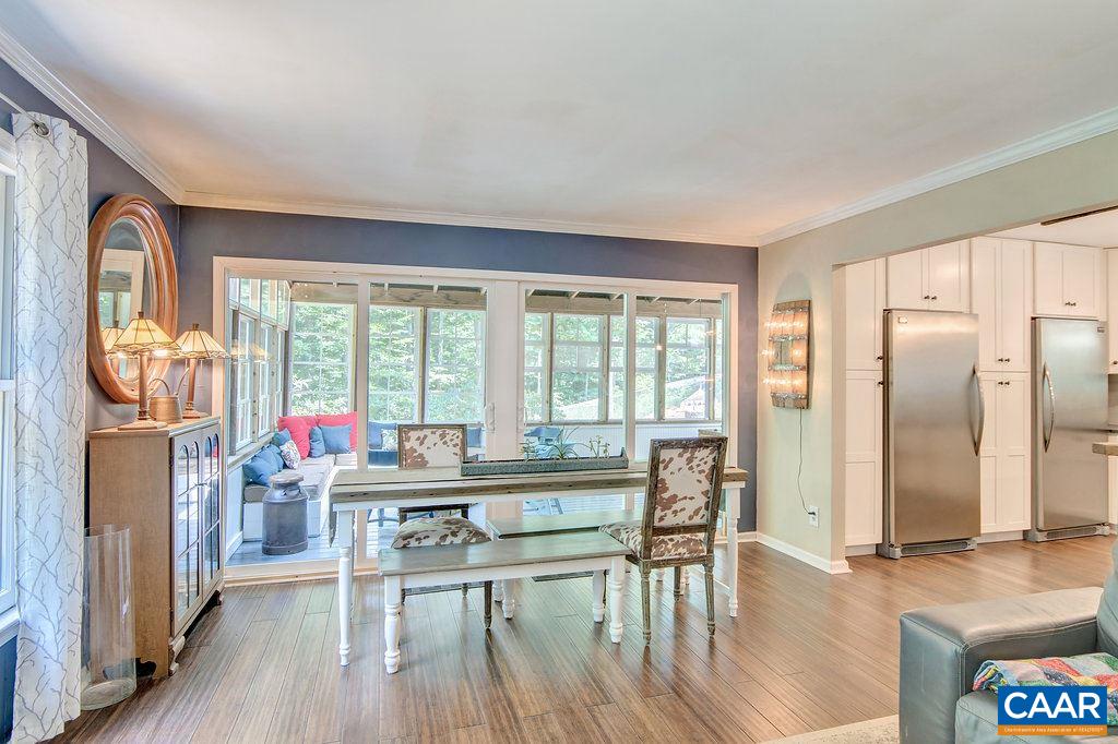 2333 Whippoorwill Road Charlottesville, VA 22901 - Photo 7 of 49 a view of a dining room with furniture window and wooden floor
