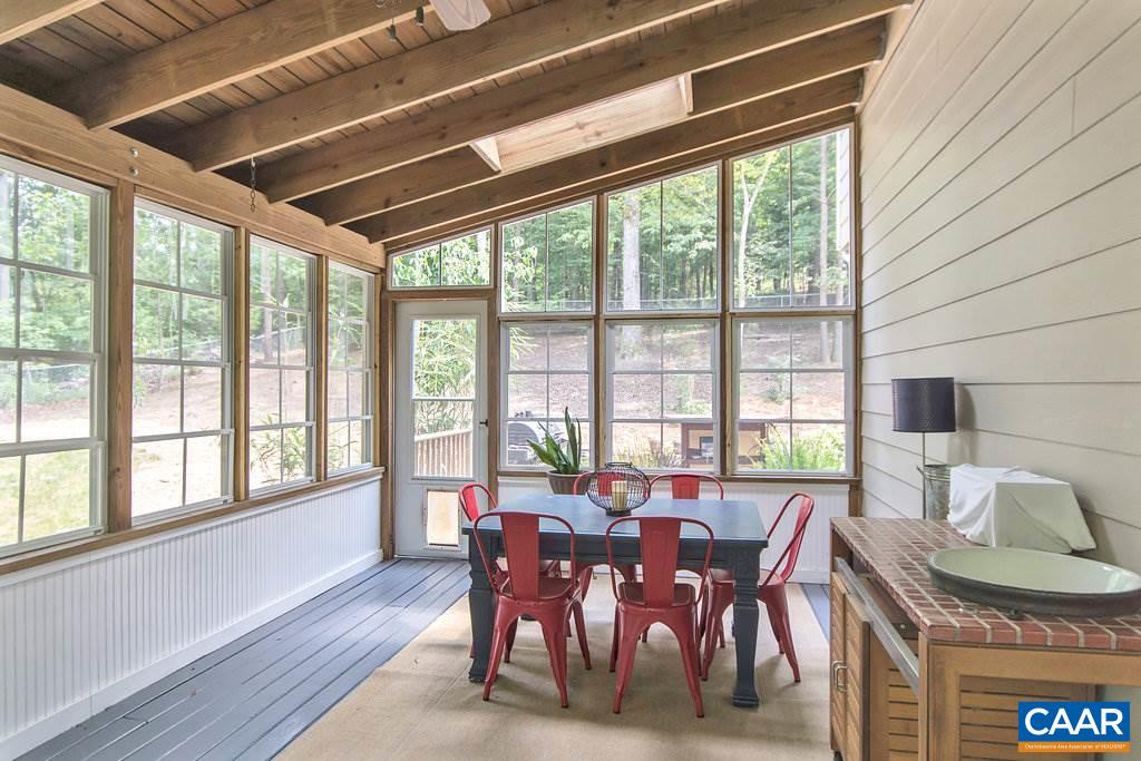2333 Whippoorwill Road Charlottesville, VA 22901 - Photo 10 of 49 a view of a dining room with furniture window and outside view