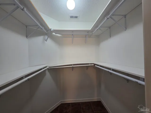 a view of a room with racks on the wall